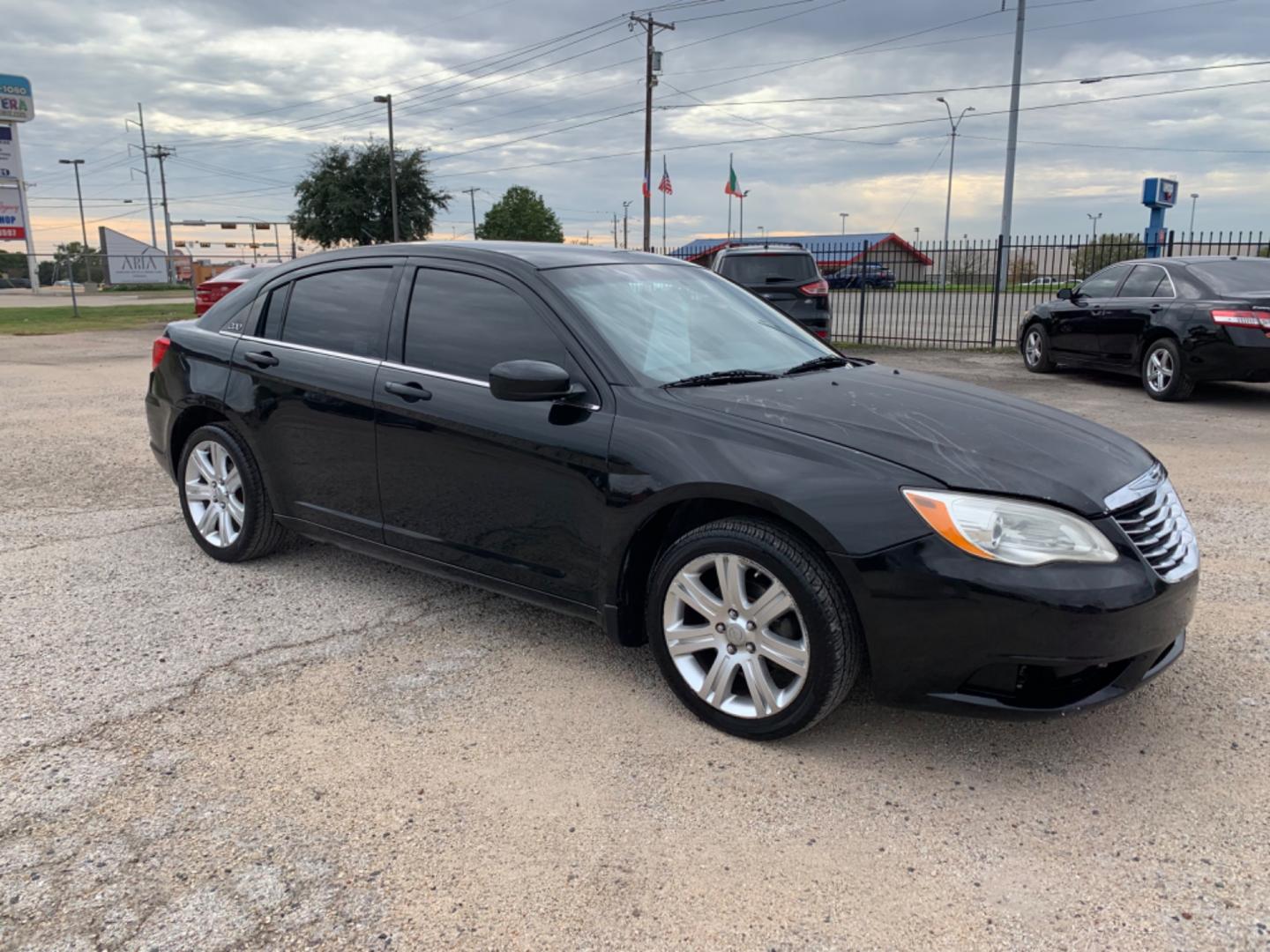 2012 Black /Black Chrysler 200 LX (1C3CCBAB3CN) with an 2.4L L4 DOHC 16V engine, Automatic transmission, located at 1830 North Belt Line Road, Irving, TX, 75061, (469) 524-0199, 32.834373, -96.993584 - Photo#6